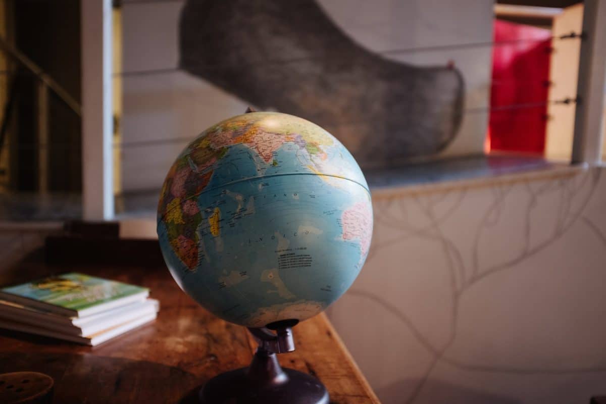 selective focus photography of desk globe on table